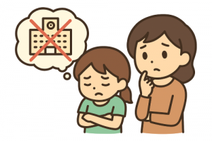 学校に行きたくない女の子と不安そうに見守る母親